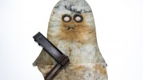 A 'PH' Helmet, used for protection against gas, and a rattle used to warn comrades of the presence of gas.