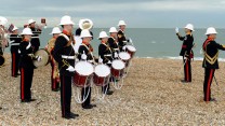 They were greeted at Eastney beach by fanfares and a display by musicians from the Royal Marines School of Music.