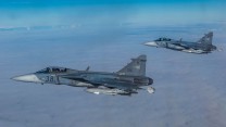 The Hungarian Gripen jets escort a Lithuanian C-27 back to
Siauliai air base during the exercise.