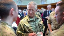 His Royal Highness The Prince of Wales (also known as the Earl of Carrick in Scotland) chats to two members of the Queen's Own Yeomanry at a Civic Reception after their parade through Ayr.