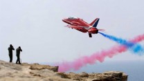 Red Seven of the Red Arrows screams past photographers waiting on a cliff edge during a practice display over RAF Akrotiri in Cyprus.

Photo Crown Copyright 2008