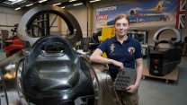 Cpl Chloe Rhodes (Avionics Tech) next to the Bloodhound Supersonic Car.