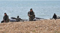 HMS Bulwark used Browndown beach in Gosport, Hampshire to practice the ships amphibious capability by sending landing craft manned by Royal Marines from the ship to the beach and flying a Merlin and Sea King Helicopter to provide air cover.