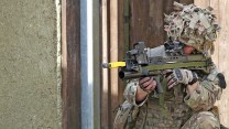 Members of 15 Squadron RAF Regiment respond to a staged attack on a mock Afghan Police Station at the Stanford Training Area (STANTA) in Norfolk during the final exercise before deploying to Afghanistan.