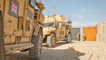 Soldiers from 4 SCOTS Bn close the gates of PB Sterga 2 for the final time as they prepare to leave the base on 10 May 2014.