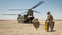 Soldiers of 4 SCOTS Bn board a British CH-47 helicopter on 10 May 2014, the final morning of the British occupation of PB Sterga 2, as they prepare to leave the base for the final time