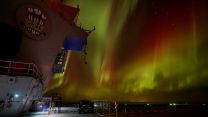Ghostly figures watch the northern lights from the flight deck of Prince of Wales (Picture: MOD).