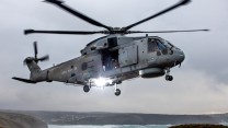 Pictured are 820 Naval Air Squadron making the most of the Cornish Landscape to hone their Fly Navy skills.  A local photographer, Greg Caygill, caught the Merlin Mk2 helicopter in the sand dunes near Perranporth beach. 