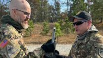 Master Gunner and Tank Commander Sergeant 1st Class William Harper presenting an aft cap from the final round fired to Jay Tenison (Picture: Courtesy Picture). 