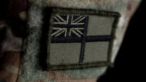 Tactical white ensign shows Royal Marines are part of Royal Navy