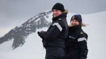 Two members of the crew of HMS Protector smiling in the snow (Picture: Royal Navy).