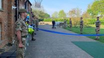 Captain Sir Tom Moore finishes his charity walk in April 2020, with a guard of honour from soldiers (Picture: MOD).