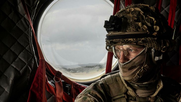 A gunner from the RAF Regiment thinks about the action to come as he flies low over the north of England on board a 27 Squadron Chinook during Exercise Cobra Warrior (Picture: MOD)