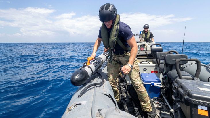 Sailors from X-Ray Squadron retrieve Remus, an autonomous underwater vehicle that scans the water for sea mines