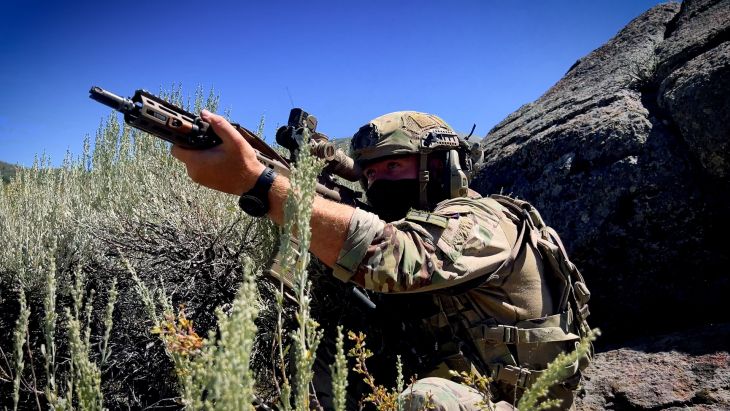 A Royal Marine takes aim with his Sig Sauer MCX rifle