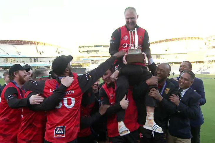 Army cricketers lift captain Liam Fletcher aloft as he holds the IST20 trophy at Lord's