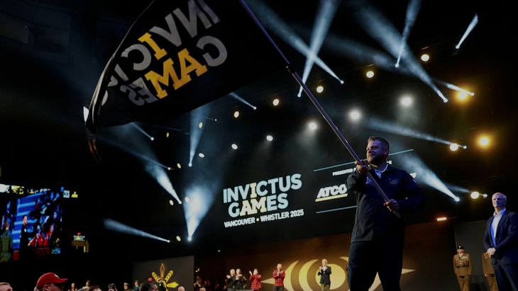 Team UK captain Stephen Hooper waves the Invictus Games flag CREDIT mod crown copyright.jpg