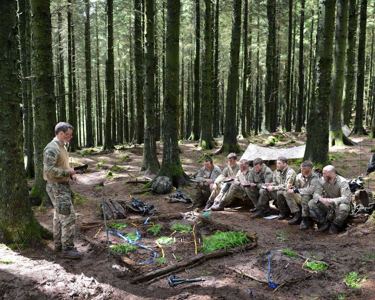 Corporals of 40 Commando camp in the woods