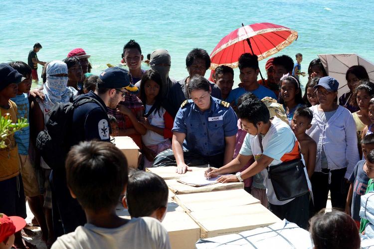 Lieutenant Wendy Frame helping Philippine locals after Typhoon Haiyan