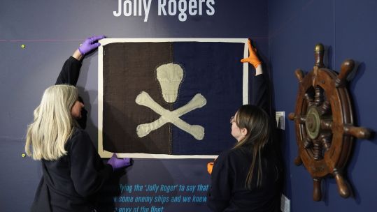 The earliest known surviving example of a Royal Navy submarine Jolly Roger, flown from HMS E54 during the First World War, is installed as part of a Jolly Roger display at the Royal Navy Submarine Museum in Gosport.