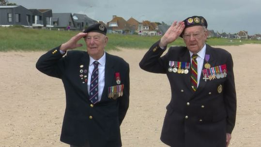 030626 D-day veterans Ken Hay and Henry Rice salute CREDIT BFBS