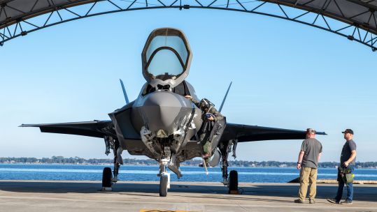 A Royal Navy pilot gets out of his F-35B inside a hardened aircraft shelter at the FRCSE facility