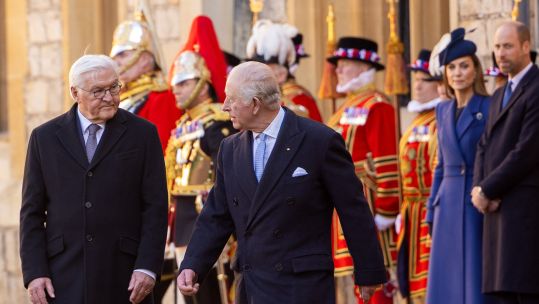 King Charles shares a few words with German president Frank-Walter Steinmeier while being escorted by the Guard of Honour at Windsor Castle