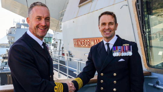 Captain Will Blackett handed over command of HMS Prince of Wales to Captain Ben Power