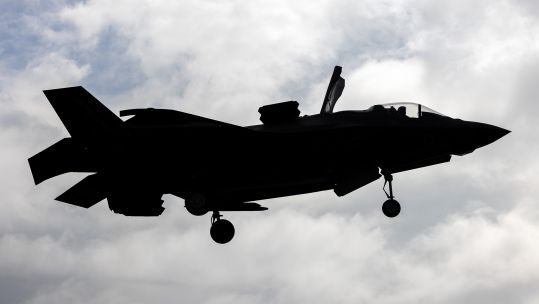 An F-35B Lightning operated by 617 Squadron comes in to land on Operation Highmast - displaying the B variant's short take-off/vertical landing capability