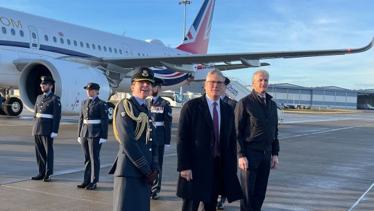 Prime Minister Keir Starmer and his Norwegian counterpart look up at the sky as Typhoons fly overhead to welcome them both to RAF Lossiemouth in Scotland to meet serving personnel