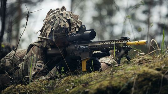 A British soldier with a Sharpshooter designated marksman rifle