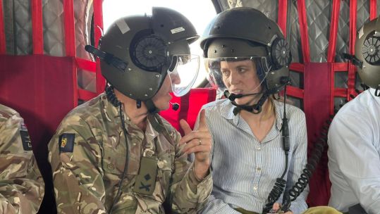 Minister for Veterans and People Louise Sandher-Jones with Commander British Forces Major General Tom Bewick in a Chinook in Cyprus