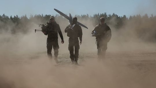 Three soldiers walking in dusty conditions on Ex Aurora CREDIT NATO