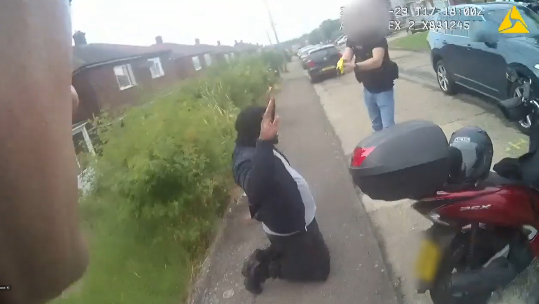 Screenshot of police cam footage of the moment Anthony Esan was arrested outside his home 