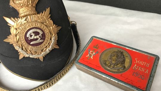 Cover image: The chocolate tin with the Boer War helmet (Picture: National Trust/Victoria McKeown).