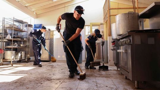 HMS Trent personnel help clean up Falmouth Hospital kitchen after Hurricane Melissa