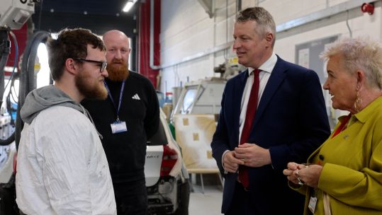 Mr Pollard (middle right) made the comments while visiting one of five newly announced defence technical excellence colleges 