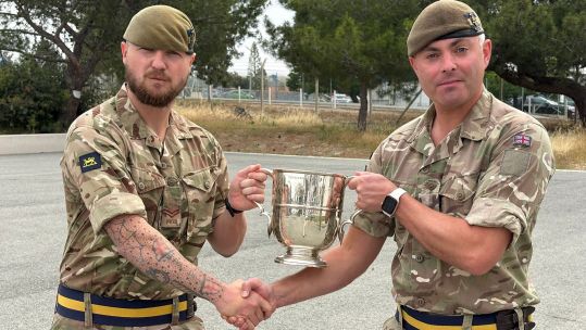 Corporal Archie Galbraith receives his well-deserved award - and a hearty handshake - from his CO, Lieutenant Colonel Alex Cherry (Picture: BFBS)