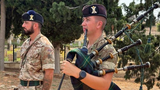 A bugler and piper played The Last Post, Reveille and a Scottish lament as the battalion remembered the fallen (Picture: BFBS)