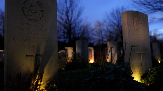 Candlelit graves at Stonefall war graves site
