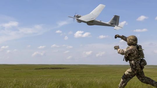 A soldier from 21 Air Assault Battery Royal Artillery launches a Puma drone during Exercise Rhino Bizz (Picture: MOD)
