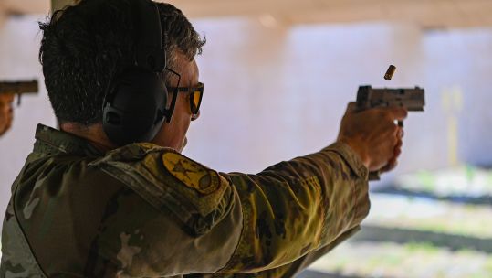 A US Air Force technical sergeant takes part in a pistol competition with his M18 - the fatal shooting also involved a member of the USAF