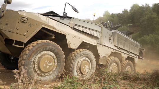 The Army's new Boxer mechanised infantry vehicle shows off its impressive off-road capability at the Defence Vehicle Dynamics exhibition at Millbrook (Picture: BFBS)