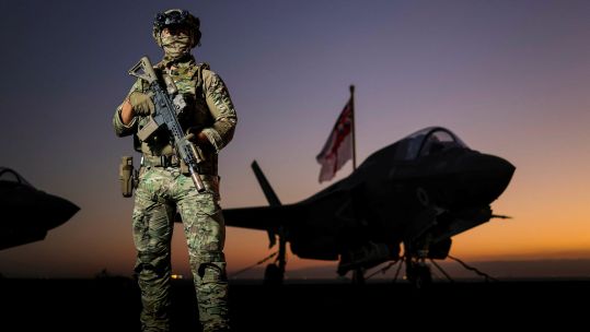 A Commando from 42 Commando Royal Marines as he conducts force protection duties onboard UK Flagship HMS Prince of Wales, as the ship transits through the Suez Canal pic MOD