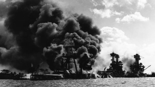 Burning ships after Japanese attack on Pearl Harbor