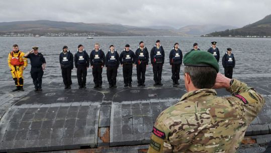Sir Gwyn salutes the casing party and they return from their record breaking deployment