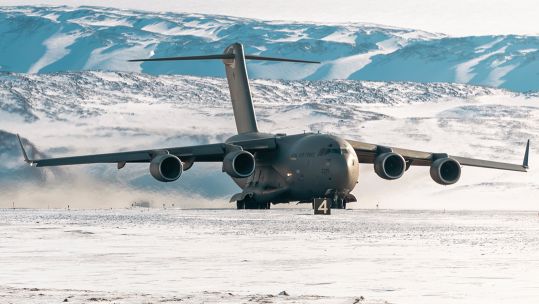 The C-17 landed on a semi-prepared runway of gravel and compacted snow after staging through Pituffik Space Base in Greenland