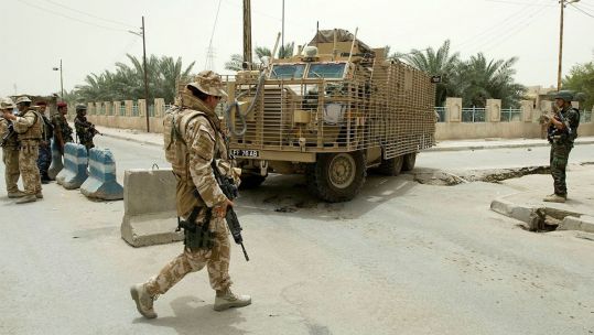 A Mastiff armoured vehicle on patrol in Basra manouevres around roadworks in the southern Iraqi capital CREDIT MOD