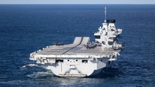 Tobias Ellwood did circles in a plane at roughly a thousand feet around the 65,000-tonne aircraft carriers (Picture: MOD)