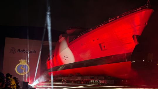 HMS Active emerges from her build hall during a ceremony in Rosyth Dockyard